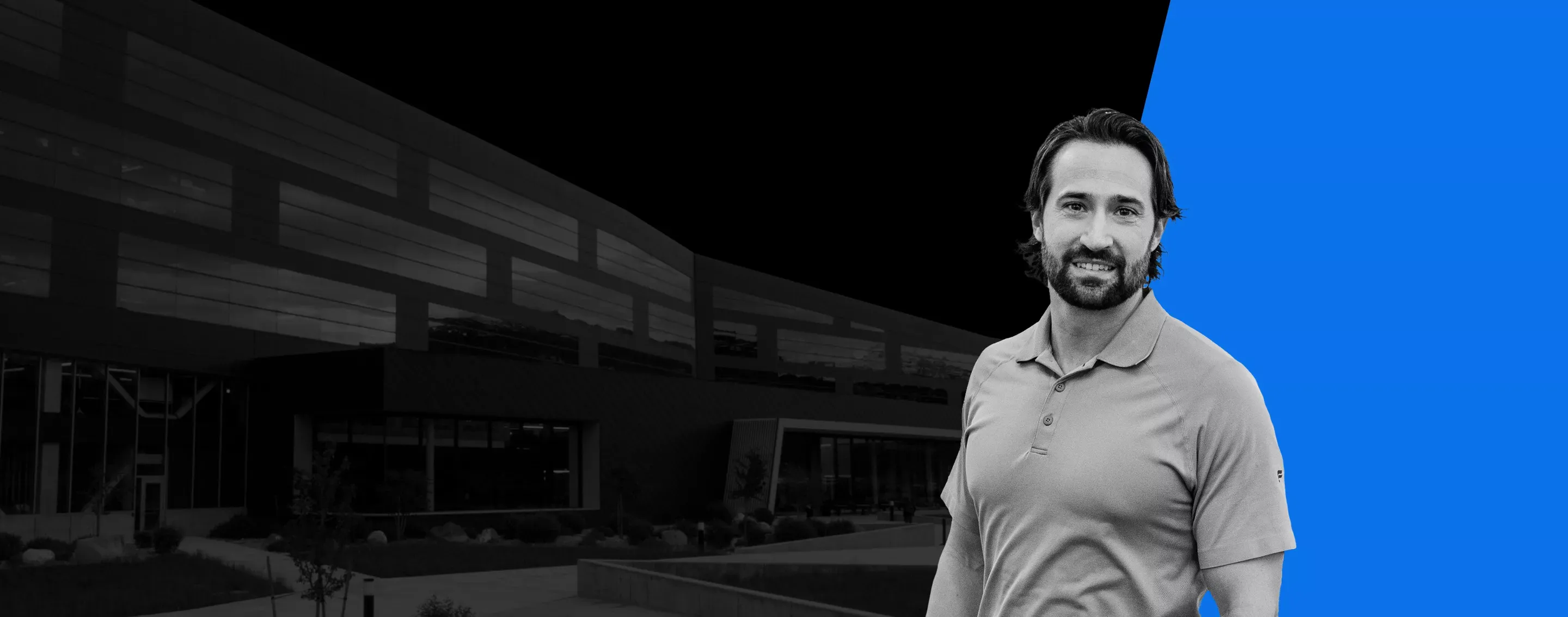 business man in front of a modern office building
