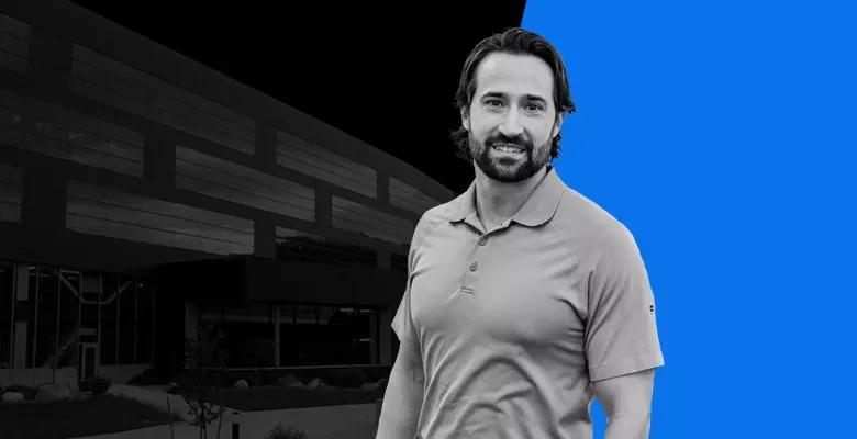 business man in front of a modern office building