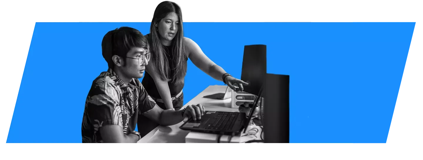 Co-workers looking at a laptop together