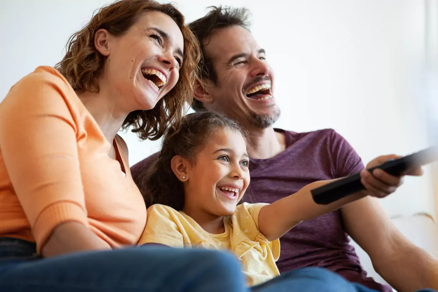 Happy family streaming their favorite movie together.