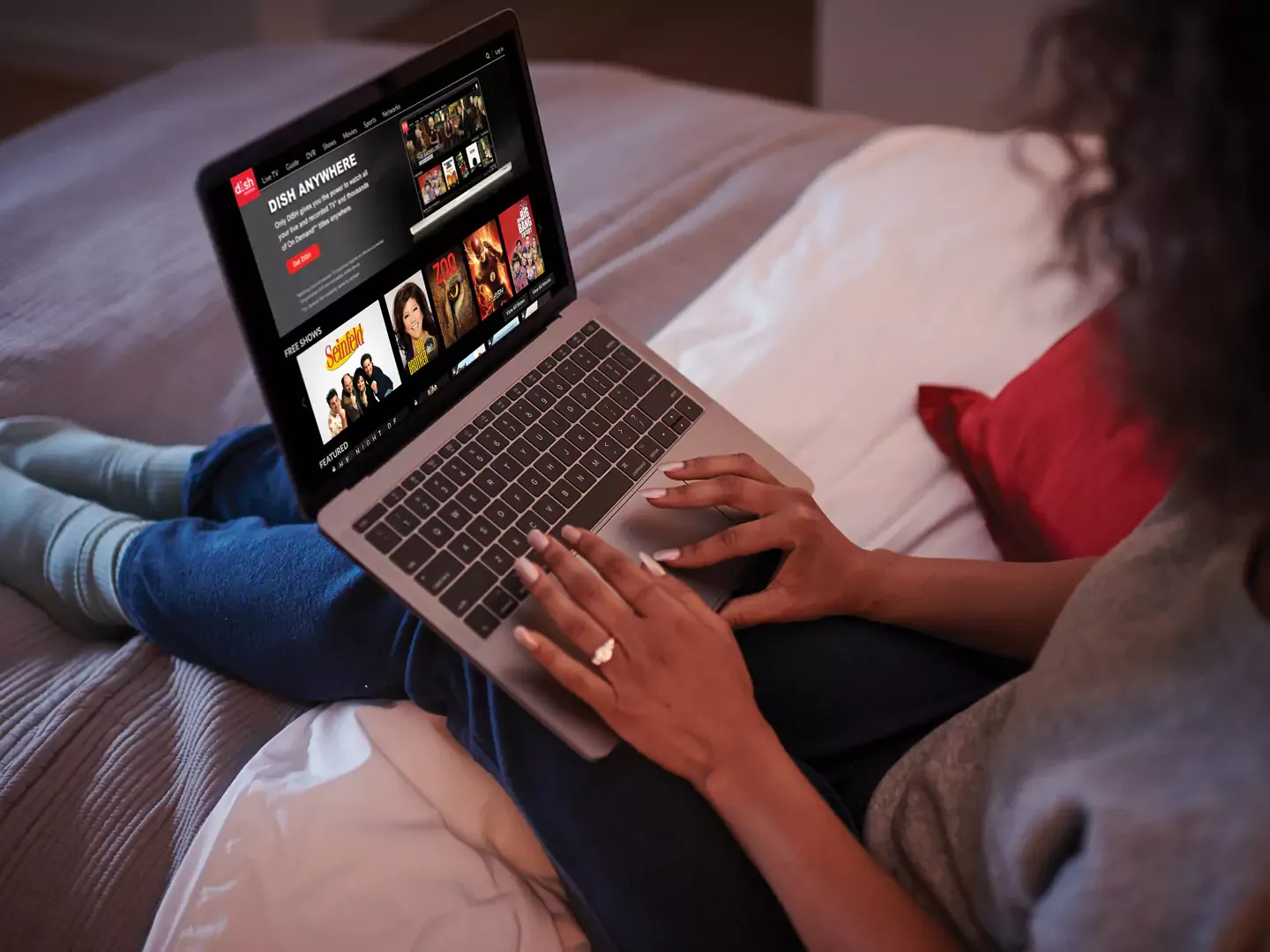 Woman streaming her favorite shows from dish on her laptop.
