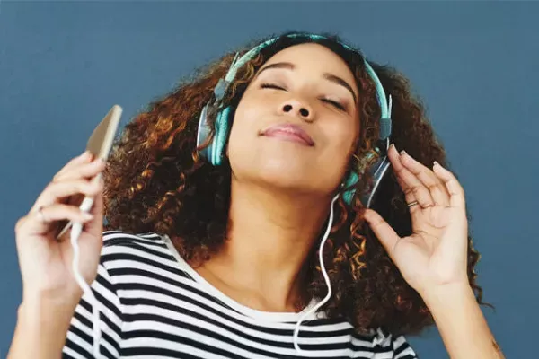 Woman listening to her favorite songs on her favorite streaming service.