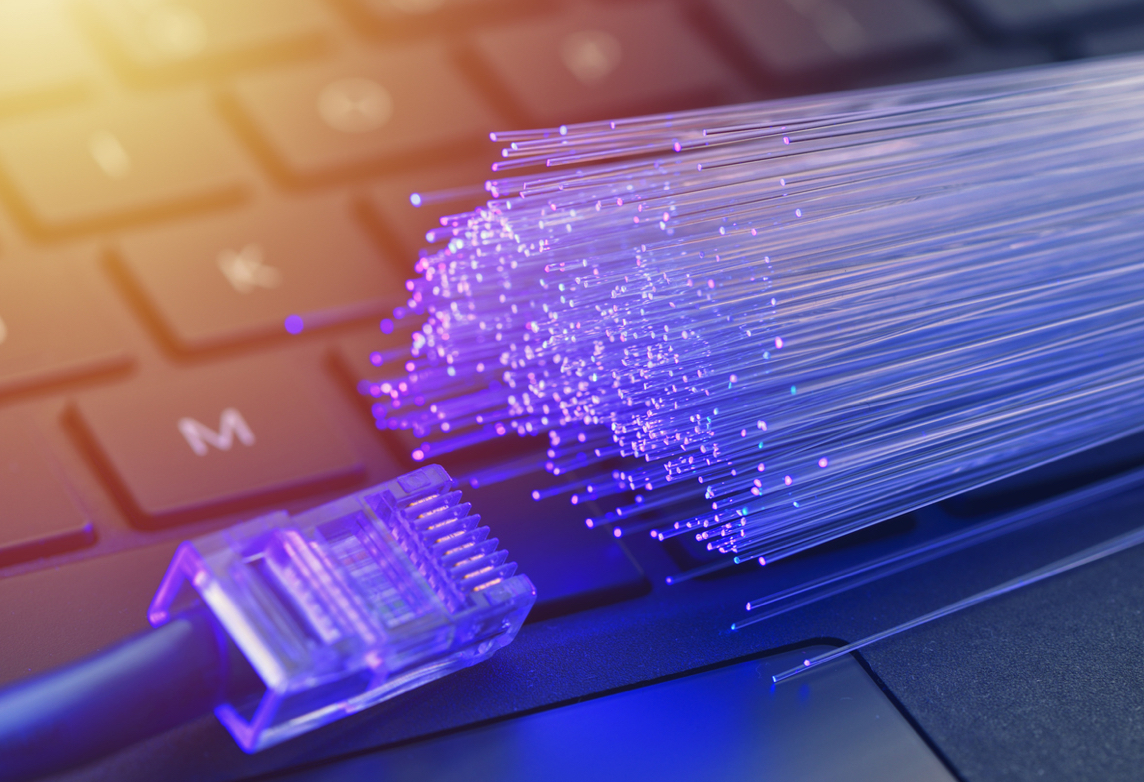 Closeup of a cable and fiber on a keyboard.