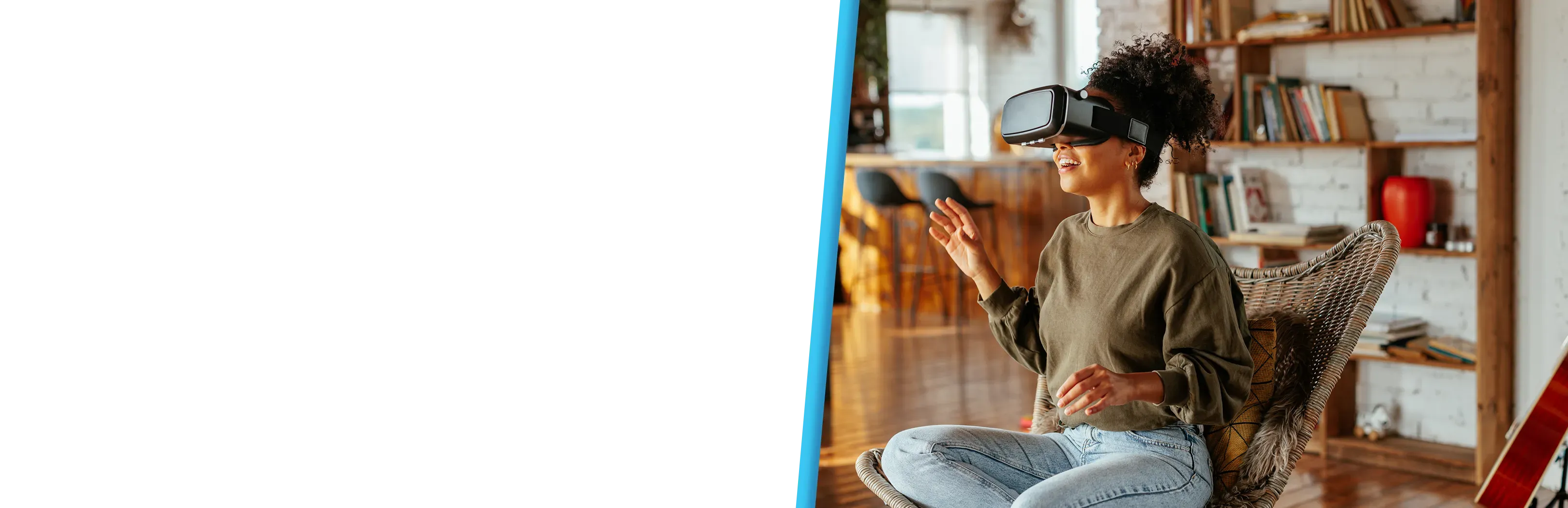 A woman smiles while gesturing with her hand during a VR headset session.