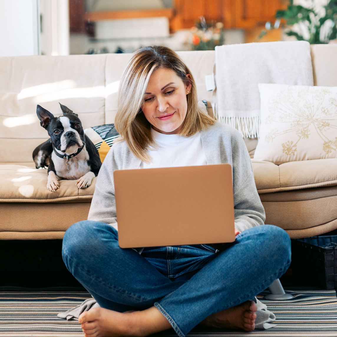 Woman browsing internet with dog