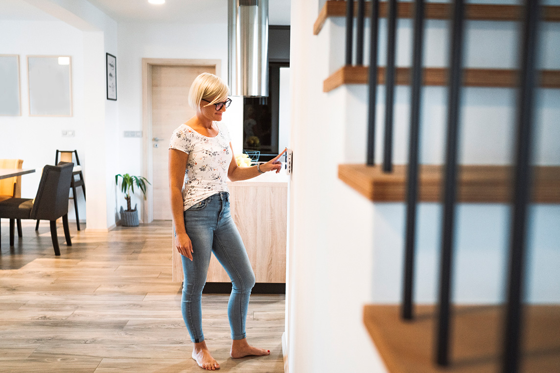 Woman using smarthome panel