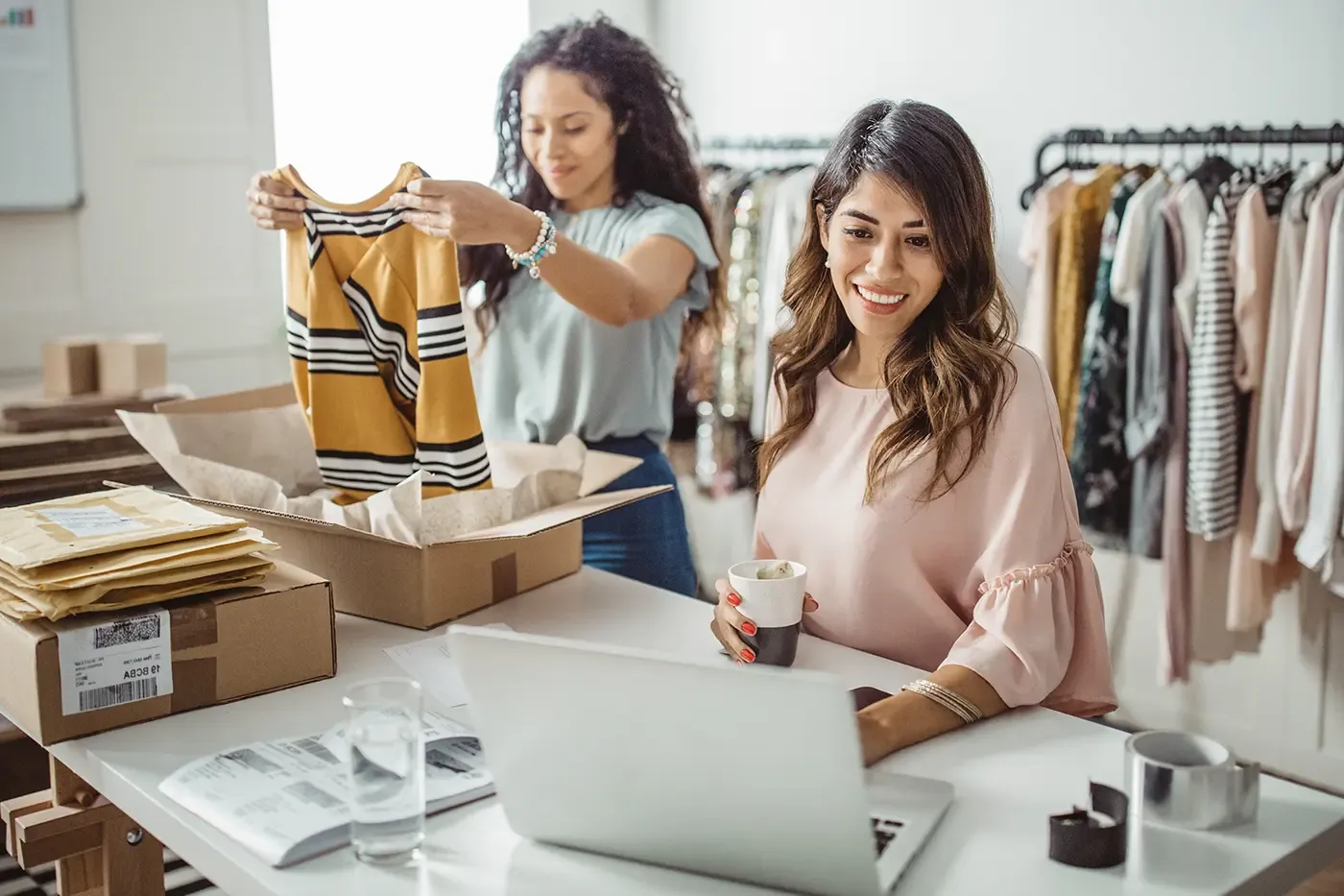 business partners prepping for a day at the clothes store