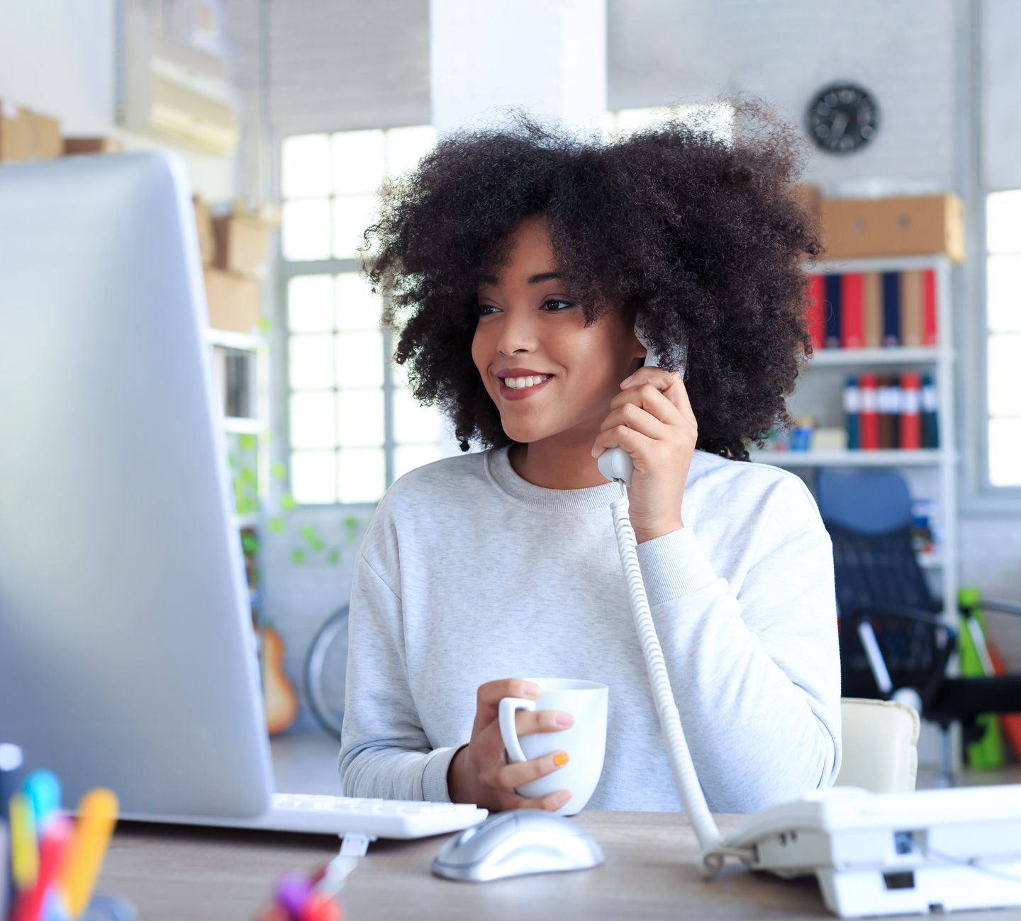 woman working from home office using CenturyLink internet and home phone