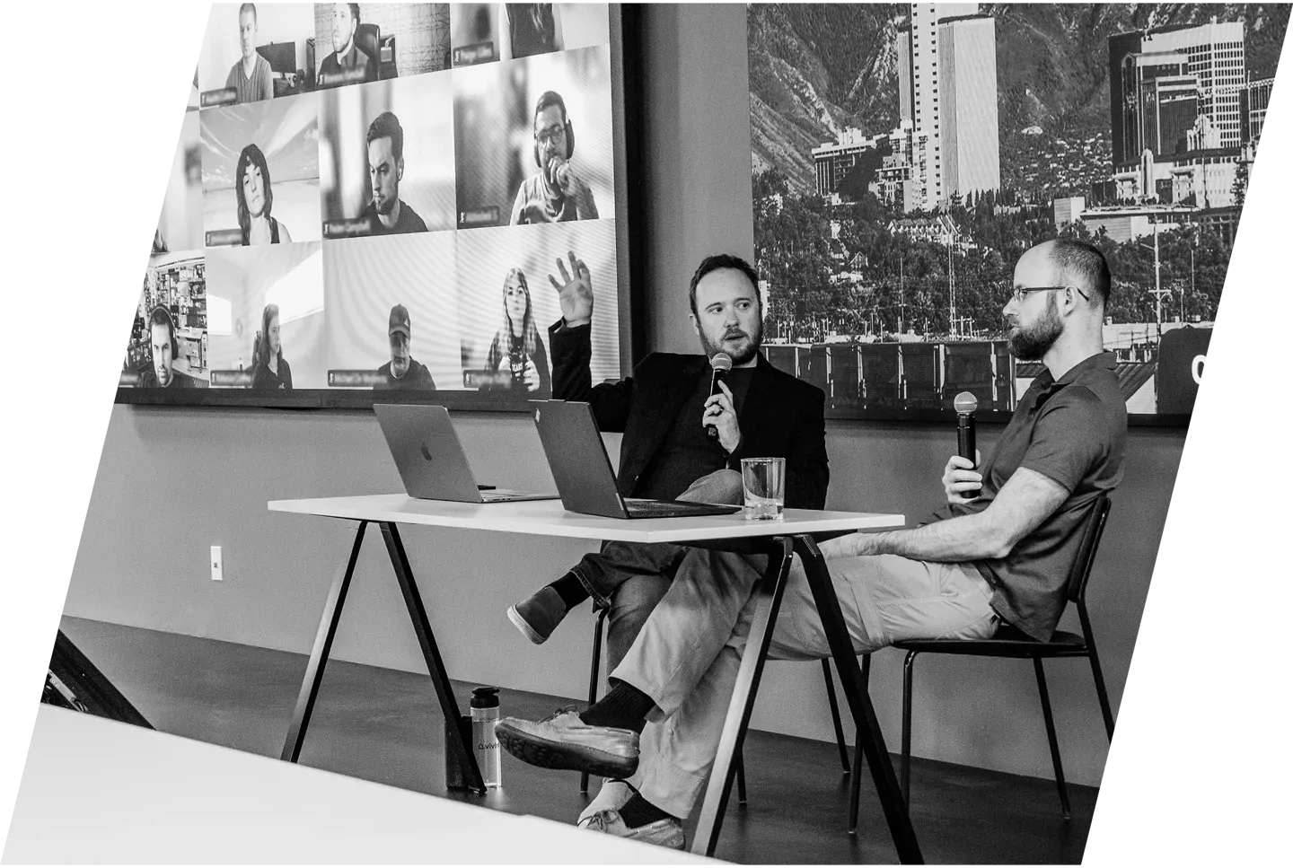 expert marketers discussing strategies in a conference room with people participating through video call