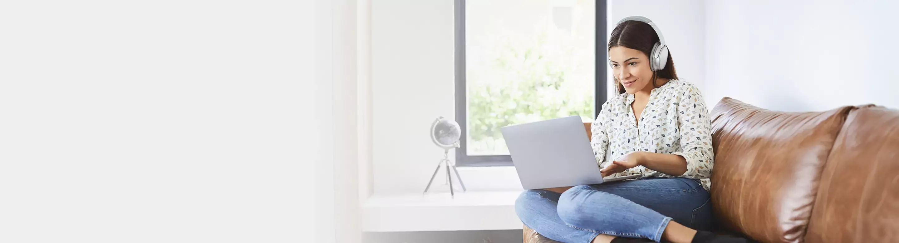young latina woman using laptop at home